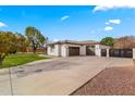 House exterior featuring a two-car garage and modern gate at 21086 E Mewes Rd, Queen Creek, AZ 85142