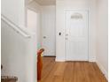 Bright foyer with hardwood floors and a white front door with decorative window at 2159 S Luther --, Mesa, AZ 85209