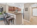 Kitchen features breakfast bar and modern appliances at 2218 E Gillcrest Rd, Gilbert, AZ 85298