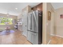 Stainless steel refrigerator in kitchen with pantry at 2218 E Gillcrest Rd, Gilbert, AZ 85298