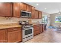 Bright kitchen with stainless steel appliances and granite countertops at 2218 E Gillcrest Rd, Gilbert, AZ 85298