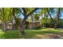 Brick home nestled among large trees at 2533 E Cheery Lynn Rd, Phoenix, AZ 85016