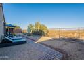 Relaxing backyard oasis with patio, seating area, and mountain views at 26063 N 83Rd Dr, Peoria, AZ 85383