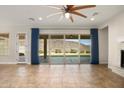 Spacious living room with sliding glass doors leading to backyard at 30401 N 115Th Dr, Peoria, AZ 85383