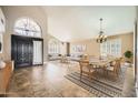 Open living area featuring elegant tile flooring, high ceilings, and modern furnishings at 30626 N 45Th Pl, Cave Creek, AZ 85331