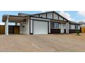 Newly remodeled single story home with a carport and a large front yard at 3214 W Grovers Ave, Phoenix, AZ 85053