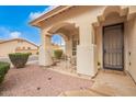 Small front porch with wrought iron railing and seating for two at 3664 E Juanita Ave, Gilbert, AZ 85234