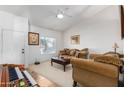 Cozy living room featuring comfortable seating and a large window at 4202 S 76Th Ln, Phoenix, AZ 85043