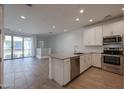 Modern kitchen with stainless steel appliances and island at 4641 S Glacier St, Mesa, AZ 85212