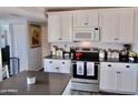 Eat-in kitchen with white cabinets and dark countertops at 5154 N 83Rd St, Scottsdale, AZ 85250