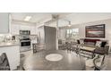 Open concept dining area with kitchen and living room views at 5518 E Lindstrom Ln # A12, Mesa, AZ 85215