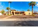 House exterior showcasing a stucco finish and a well-maintained front yard at 6030 E Crocus Dr, Scottsdale, AZ 85254