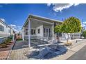 Another view of the home's exterior and carport at 7750 E Broadway Rd # 83, Mesa, AZ 85208