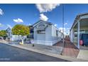 Side view of manufactured home showing additional parking at 7750 E Broadway Rd # 83, Mesa, AZ 85208