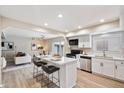 Modern kitchen with island, stainless steel appliances, and white cabinets at 8578 E Indian School Rd # I, Scottsdale, AZ 85251