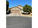 Charming single-story home with a well-maintained front yard, mature trees, and a two-car garage at 9024 W Alda Way, Peoria, AZ 85382