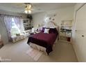 Spacious bedroom with plush bedding and window at 10602 W Deanne Dr, Sun City, AZ 85351