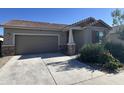 Charming one-story house with a two-car garage and well-maintained landscaping at 10961 W Taylor St, Avondale, AZ 85323