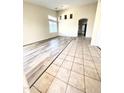 Spacious living room featuring tile and wood-look flooring at 13622 W Peck Ct, Litchfield Park, AZ 85340