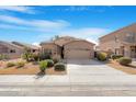 Charming single-story home featuring low-maintenance desert landscaping, a two car garage, and an inviting facade at 1369 E Linda Dr, Casa Grande, AZ 85122