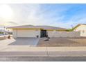 House exterior featuring a single-story home with a garage and front yard at 14202 N Buttercup Dr, Sun City, AZ 85351