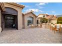 Inviting front patio with seating area and brick paving at 3182 N 159Th Dr, Goodyear, AZ 85395