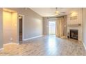 Living room features wood-look floors, fireplace, and patio access at 4135 N 17Th St # 11, Phoenix, AZ 85016