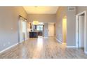 Spacious living room with wood-look floors and kitchen view at 4135 N 17Th St # 11, Phoenix, AZ 85016