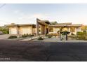 Contemporary home with desert landscaping, modern design, and a three-car garage at 4414 E Vermont S Ave, Phoenix, AZ 85018