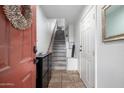 Bright entryway with tiled floors, staircase, and access to other rooms at 4455 E Paradise Village S Pkwy # 1031, Phoenix, AZ 85032
