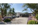 Spacious driveway with gates and beautiful landscaping at 6126 E Maverick Rd, Paradise Valley, AZ 85253