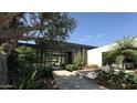 Elegant entryway with water feature and lush landscaping at 6126 E Maverick Rd, Paradise Valley, AZ 85253