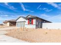 Charming single-story home with drought resistant landscaping and a two-car garage at 7366 E Hackamore Ln, San Tan Valley, AZ 85143