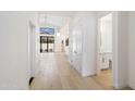 Hallway view leading to a bright living space and bathroom at 7955 E Chaparral Rd # 116, Scottsdale, AZ 85250