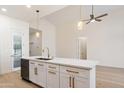 Kitchen island features marble countertops and modern fixtures at 7955 E Chaparral Rd # 116, Scottsdale, AZ 85250