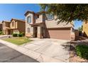 Two-story house with a two-car garage and a tree-lined street at 8454 E Keats Ave, Mesa, AZ 85209