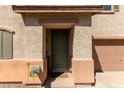 Inviting front entrance with a green door and landscaping at 8454 E Keats Ave, Mesa, AZ 85209