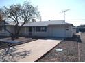 Ranch home with a single car garage and nicely landscaped yard at 11001 W Connecticut Ave, Sun City, AZ 85351