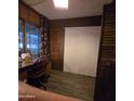 Small bedroom with a desk, chair, and double closet at 11411 N 91St Ave # 80, Peoria, AZ 85345