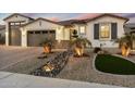 Lovely two-story home with a welcoming front porch and beautifully landscaped yard at 12528 W Tuckey W Ln, Glendale, AZ 85307