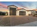 This home boasts a large three-car garage and a spacious driveway at 12528 W Tuckey W Ln, Glendale, AZ 85307