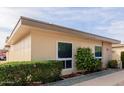 Light-beige condo building with walkway and landscaping at 14017 N 111Th Ave, Sun City, AZ 85351