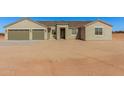 Newly built home with a three-car garage at 19430 E Erik Ct, Florence, AZ 85132