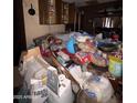 Kitchen area cluttered with various items at 215 S 32Nd Dr, Phoenix, AZ 85009