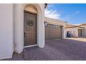 Close-up of the front door and brick driveway leading to the garage at 22235 E Cherrywood Dr, Queen Creek, AZ 85142