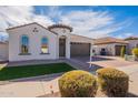 Beautiful single-story home featuring a two-car garage and front yard at 22235 E Cherrywood Dr, Queen Creek, AZ 85142