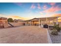 Large backyard with covered patio, hot tub, and play structure at 22812 E Excelsior Ave, Queen Creek, AZ 85142