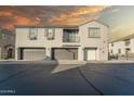 Two-story townhome with attached garage and balcony, under a sunset sky at 2960 E Darrow St, Phoenix, AZ 85042