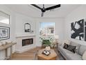 Light and airy living room with fireplace, hardwood floors and large window at 2992 N Miller Rd # 210A, Scottsdale, AZ 85251