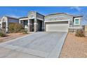 Inviting single-Gathering home with a neutral facade, manicured landscaping, and a spacious two-car garage at 30968 W Monterey Ave, Buckeye, AZ 85396